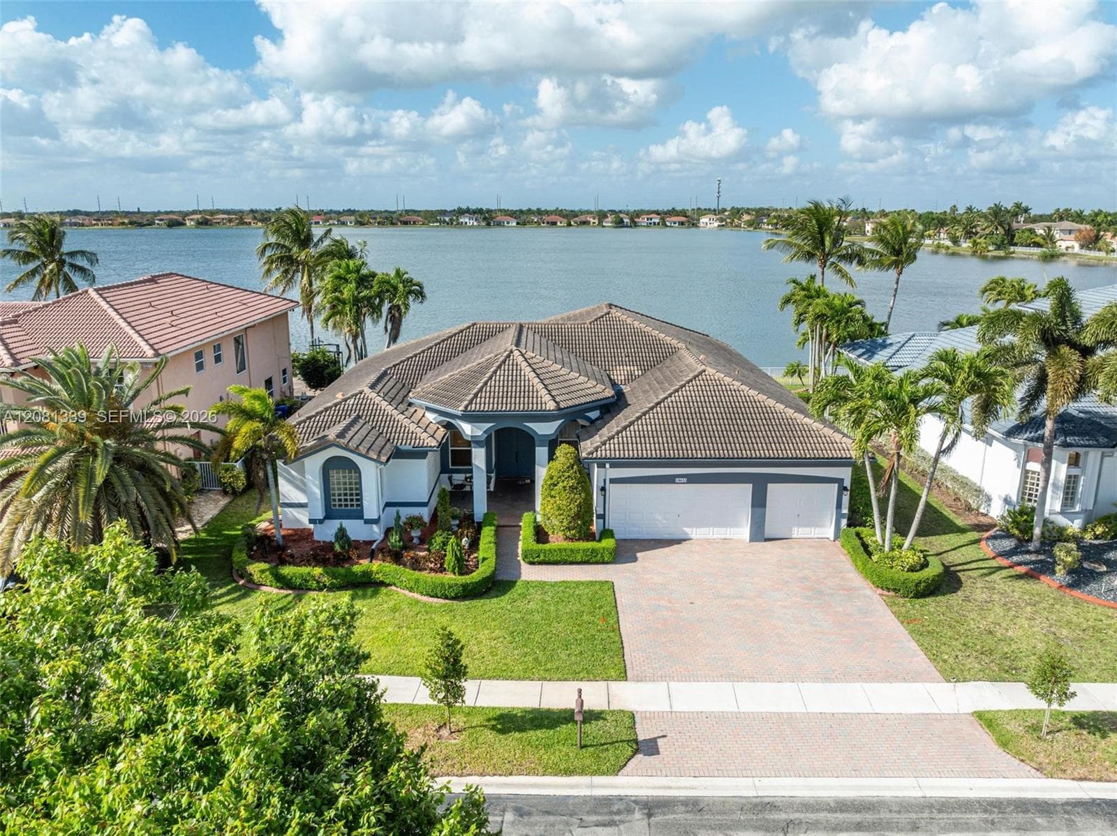Aerial view of the lakefront home at 18633 SW 24th St